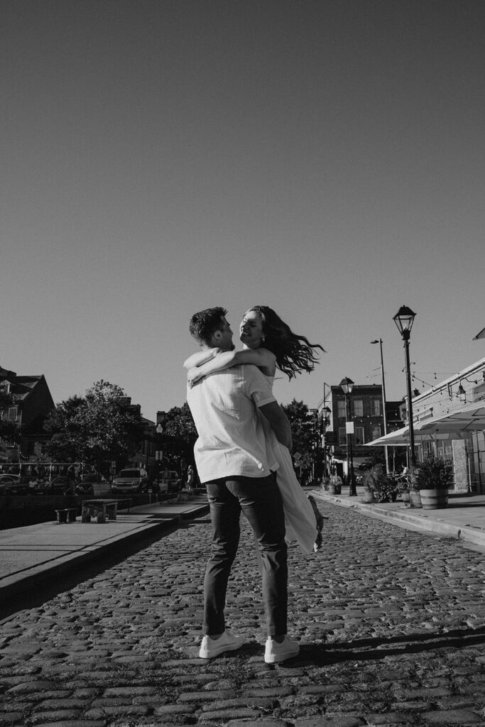 Candid engagement photo in Fells Point Baltimore